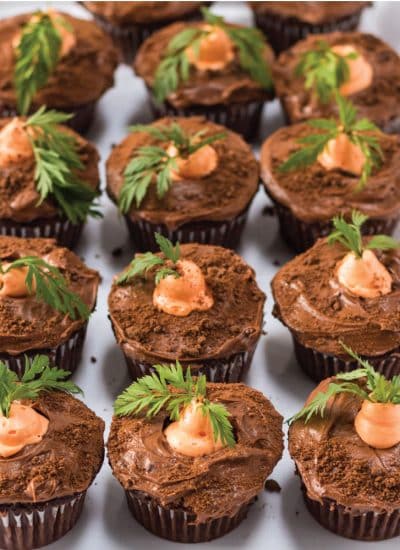 white plate full of carrot patch cupcakes