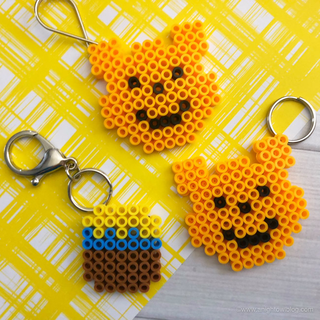 Winnie the Pooh and honey pot keychains made from Perler Beads.