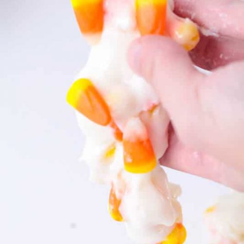 White edible slime with candy corns.