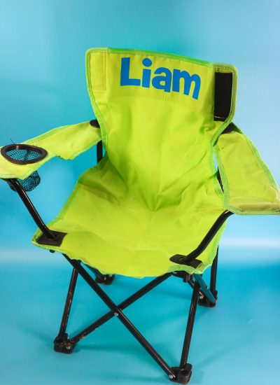 Personalized camp chair. green chair with name on it in blue iron on