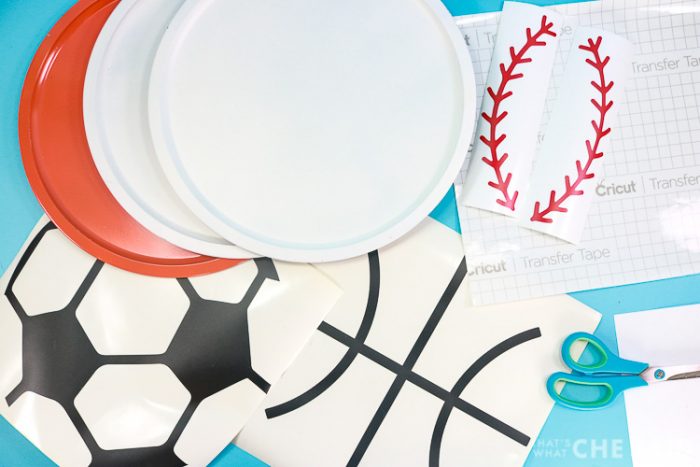 Supplies for Sports Magnet Boards, painted pizza pans, vinyl, transfer tape, scissors and hook and scraper