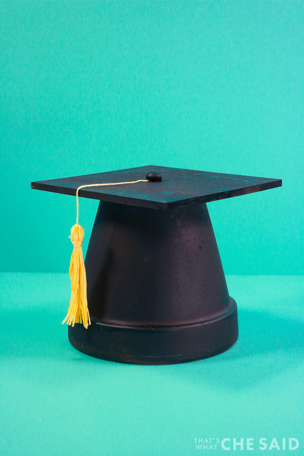 Vertical of finished clay pot grad cap