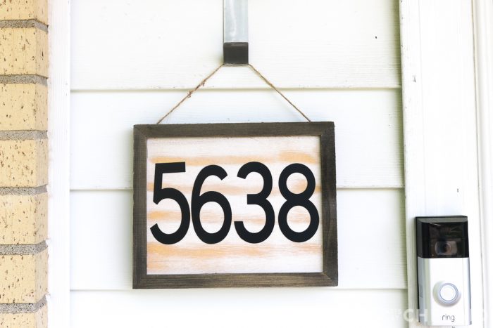 DIY House number sign hanging next to front door - close up