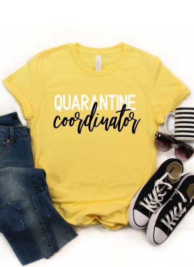 Yellow shirt with "Quarantine Coordinator" in iron on with jeans, converse coffee mug and sunglasses - Vertical
