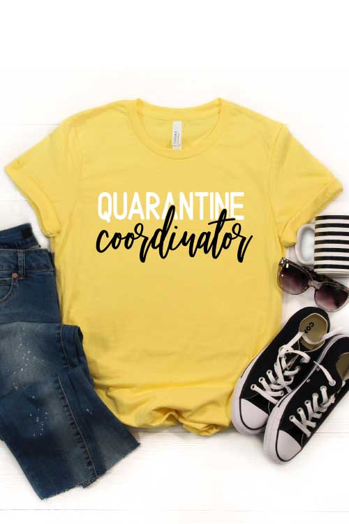 Yellow shirt with "Quarantine Coordinator" in iron on with jeans, converse coffee mug and sunglasses - Vertical