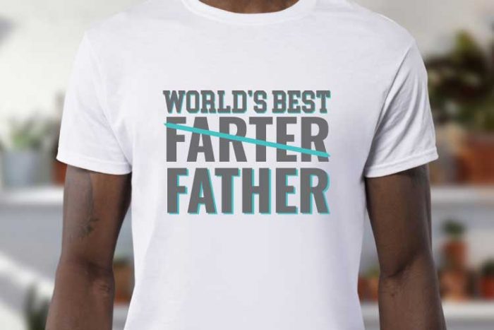 Man wearing white t-shirt with iron on in the quote "World's Best Farter (crossed out) Father" - horizontal orientation