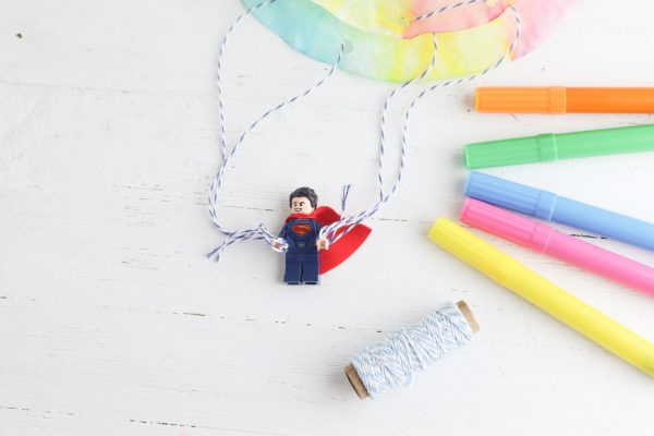 Lego Man attached to coffee filter parachute