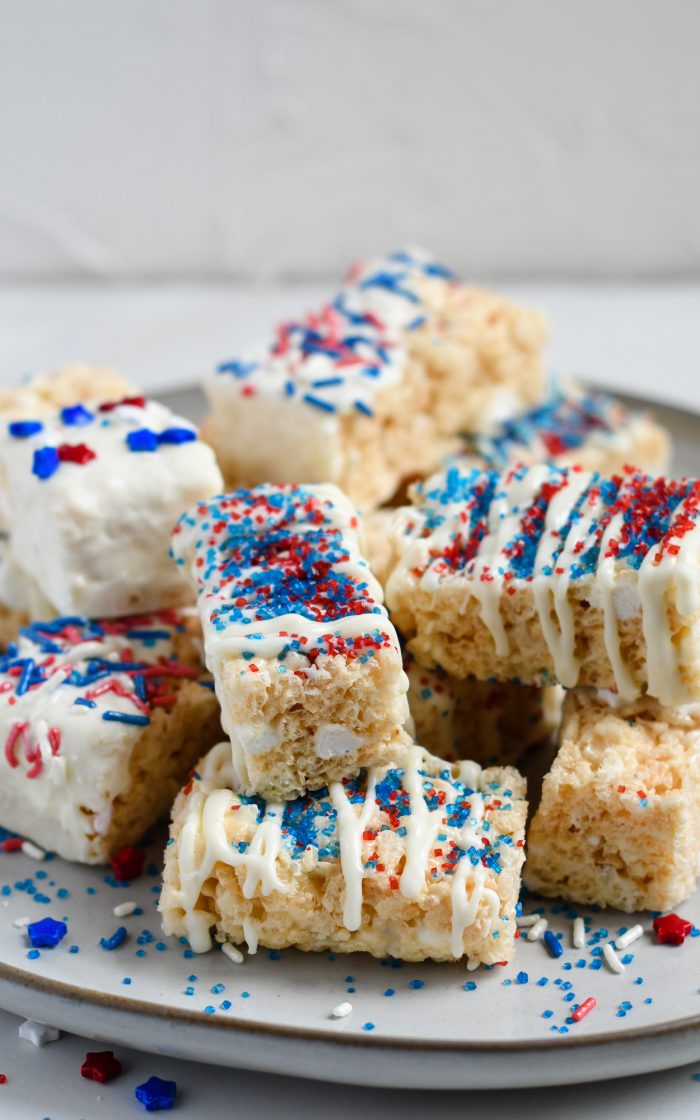 Serving tray full of patriotically decorated Rice Krispie Treats - Vertical Shot