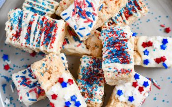 Top down view of Patriotic Rice Krispie Treats stacked on a plate