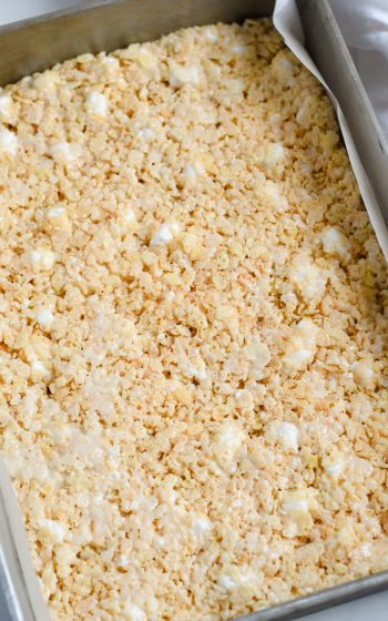 Overhead shot of rice krispie treats cooling in the pan