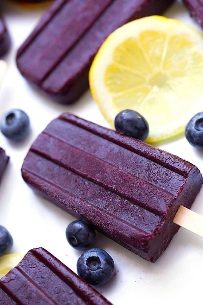 Blueberry Lemon Pops with blueberries and a slice of lemon