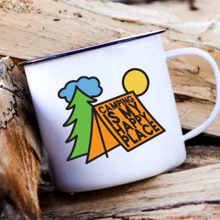 Camp Mug on a stack of wood with Camping is My Happy Place SVG in vinyl - Vertical