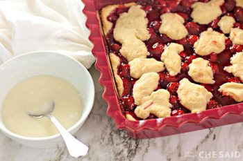 Baked Cherry Bars with Frosting in a bowl