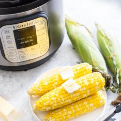 IP Corn on the Cob - Cobs on a plate with butter pats