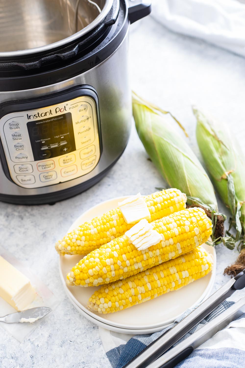 IP Corn on the Cob - Cobs on a plate with butter pats