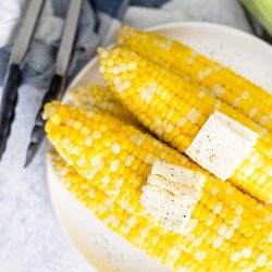 IP Corn on the Cob - Cobs on a plate with butter pats