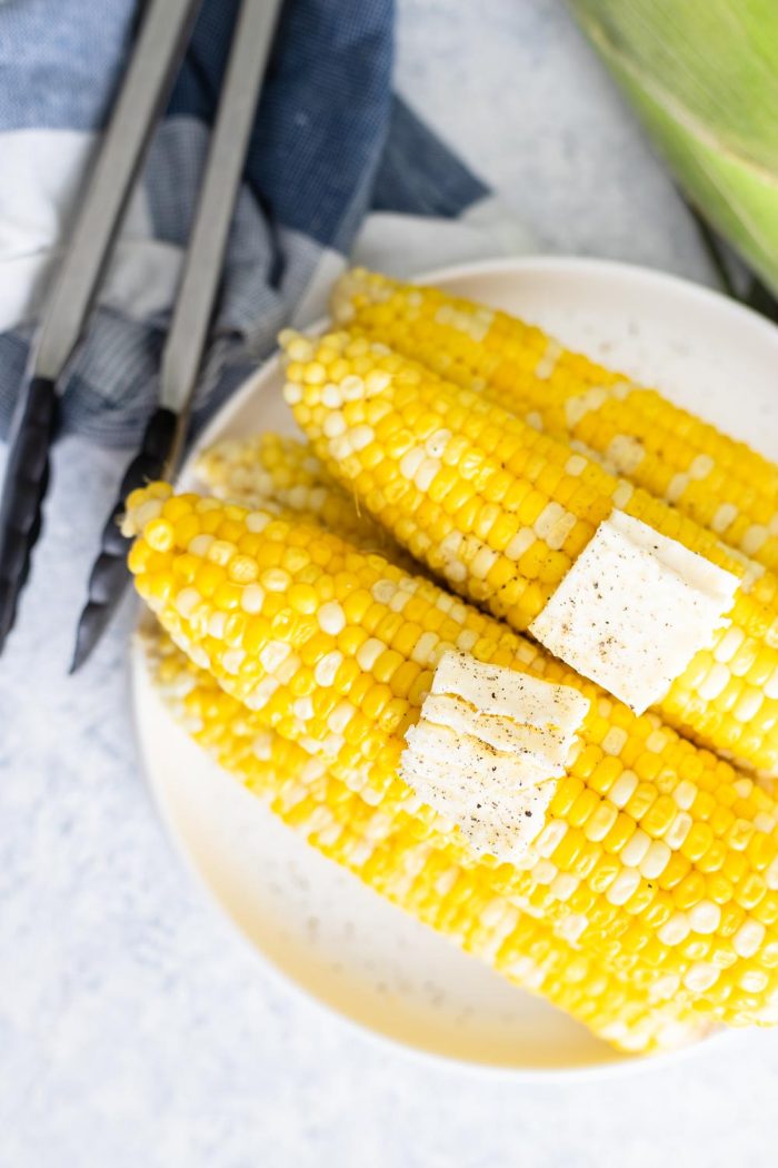 IP Corn on the Cob - Cobs on a plate with butter pats