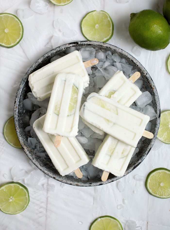 Limeade Pops in bowl of ice with lime slices around