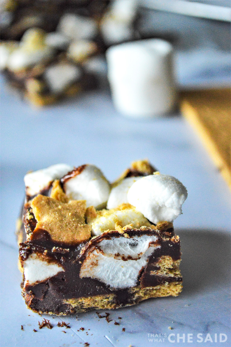 close up of smore fudge piece with ingredients in background
