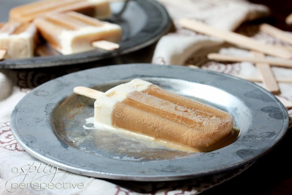 Coffee Popsicle laying on frosted metal plate