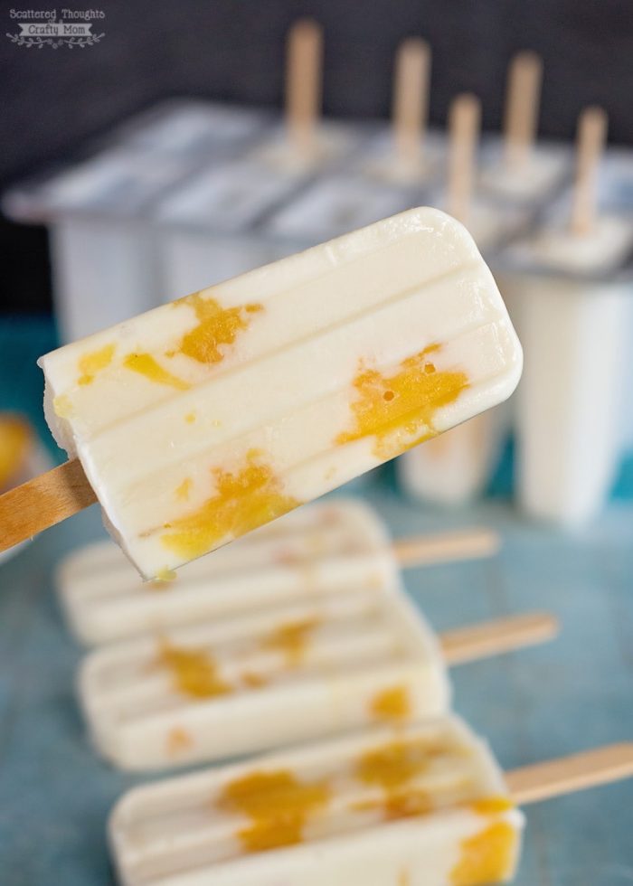 Peach yogurt Pops close up of one and rest in mold in background