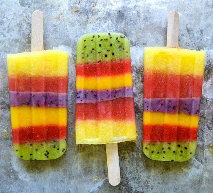 Popsicles made with whole fruit and layered in different colors