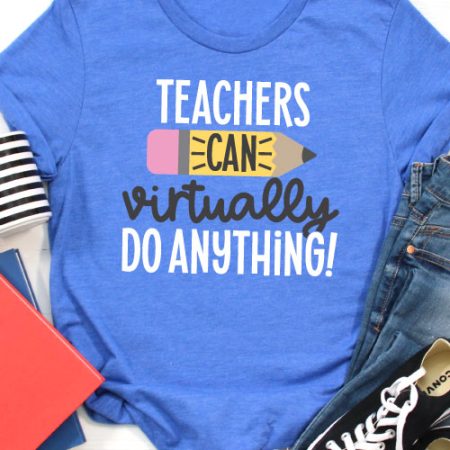 Blue T-shirt with jeans, converse, a coffee mug and folders that has the SVG File "Teachers Can Virtually Do Anything" in iron on in vertical orientation