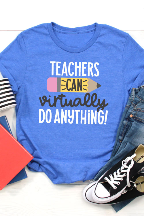 Blue T-shirt with jeans, converse, a coffee mug and folders that has the SVG File "Teachers Can Virtually Do Anything" in iron on in vertical orientation