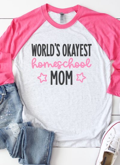 White Raglan T-shirt with Pink sleeves and jeans and sneakrs. Shirt reads "World's Okayest Homeschool Mom" in iron on vinyl - Square Format