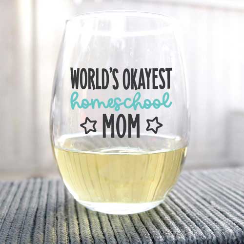 Wine Glass with "World's Okayest Homeschool Mom" applied with adhesive vinyl