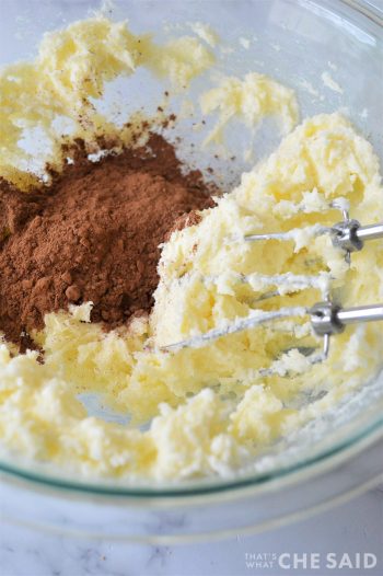 Clear Mixing Bowl with creamed butter and sugar and cocoa powder