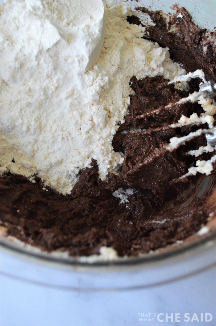 Adding dry ingredients into cocoa butter mixture