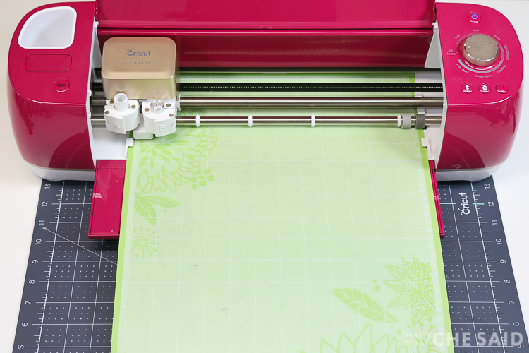 Cricut Explore Air 2 cutting a plastic cutting mat from dollar store to be used at a tracing mat