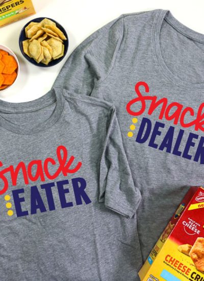 2 Grey shirts, adult shirt has Snack Dealer adn child shirt has snack eater in iron on vinyl