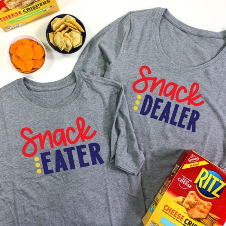 2 Grey shirts, adult shirt has Snack Dealer adn child shirt has snack eater in iron on vinyl