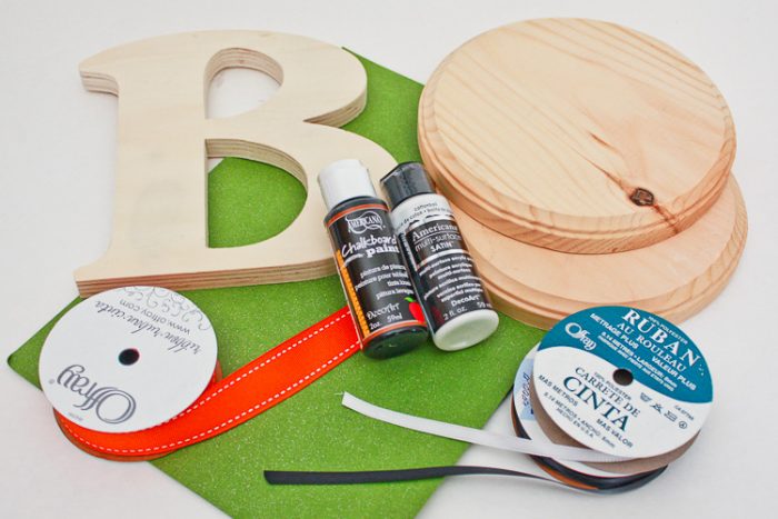 Supplies for Boo Door Hanging: 2 wooden circles, wooden B, Paint, Paint brush, Ribbon, Cardstock, Red Pen