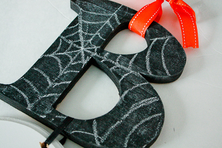 use chalk to make spiderweb