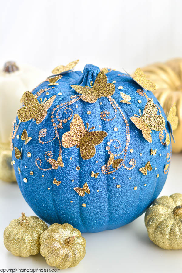 Cinderella Pumpkin. Pumpkin spraypainted blue glitter and gold accents added