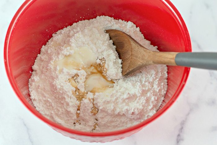 Pumpkin donut glaze ingredients in a bowl ready to mix