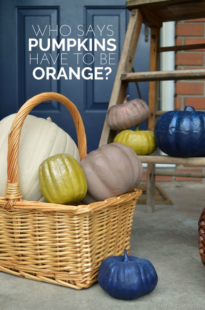 pumpkins on a porch that have been spraypainted non traditional solid colors