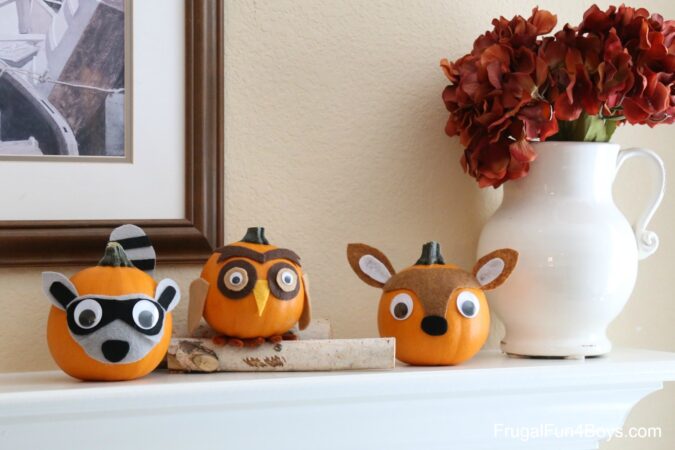 Small pumkins with felt accents to resemble woodland creatures