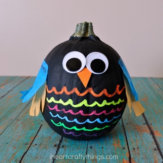 A pumpkin painted and accents added to resemble an owl