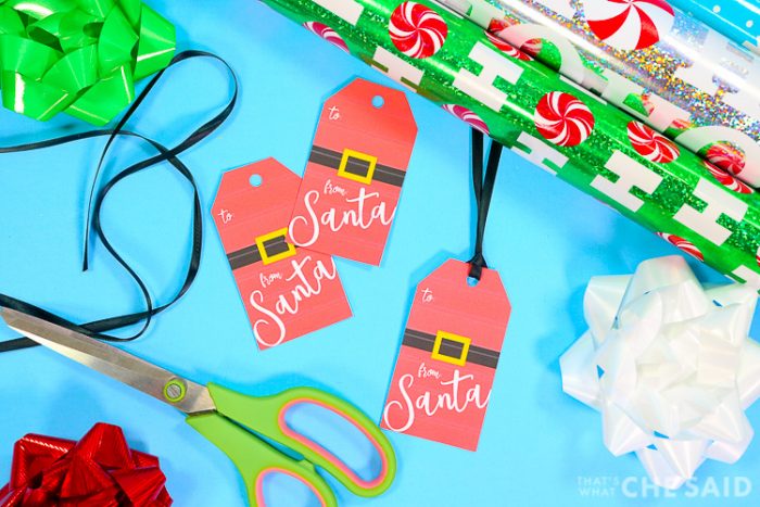 From Santa Gift Tags with gift wrap, ribbon, bows and scissors - horizontal layout