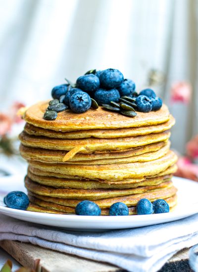 Stacked Pumpkin Pancakes with Blueberries and Pumpkin seed topping