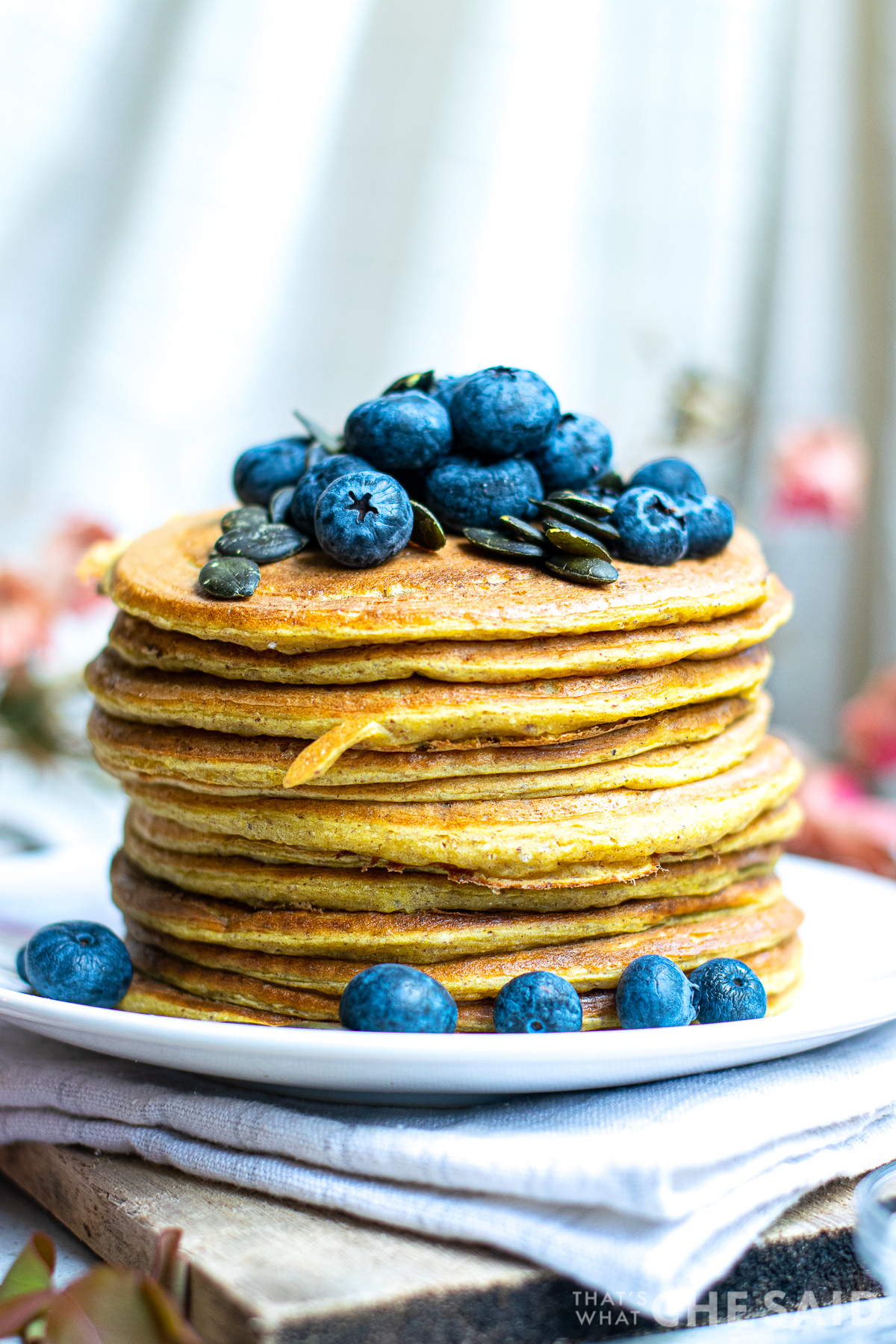 Stacked Pumpkin Pancakes with Blueberries and Pumpkin seed topping