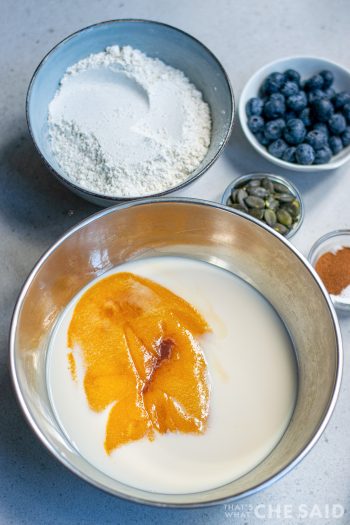 Add pumpkin to milk in bowl