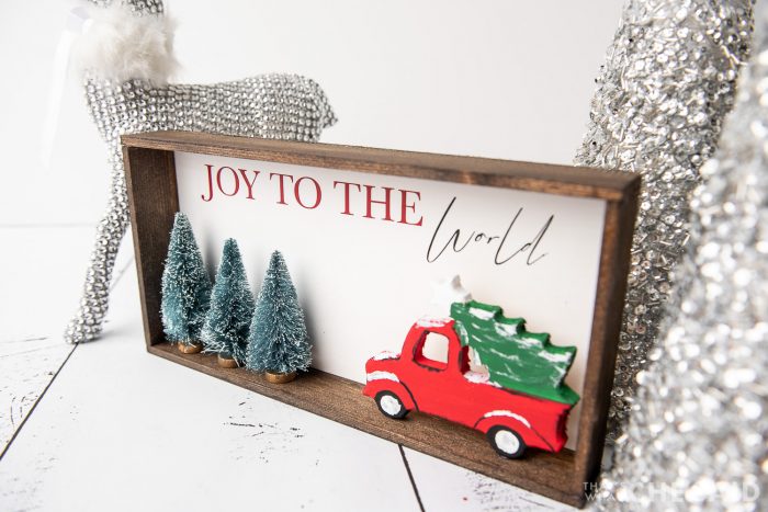 DIY Christmas Sign with Silver trees and deer in background - horizontal