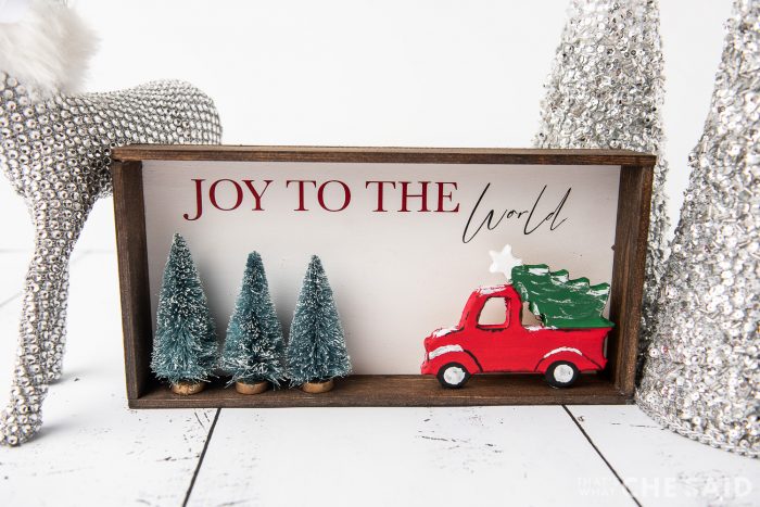 DIY Christmas Sign with Silver trees and deer in background - horizontal