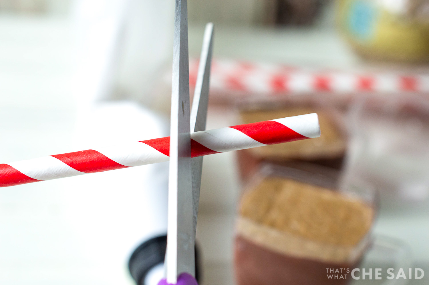 Trim a paper straw to size with scissors