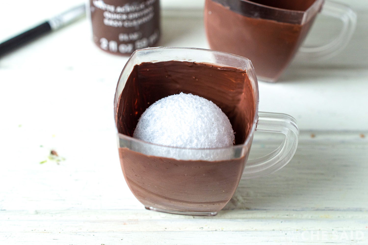 Add styrofoam ball inside cup to take up space